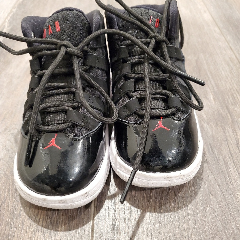 Kids red and black Jordans